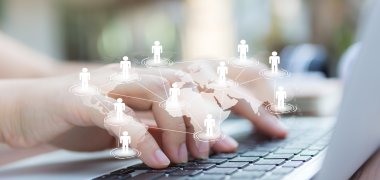 Closeup of business woman hand typing on laptop keyboard