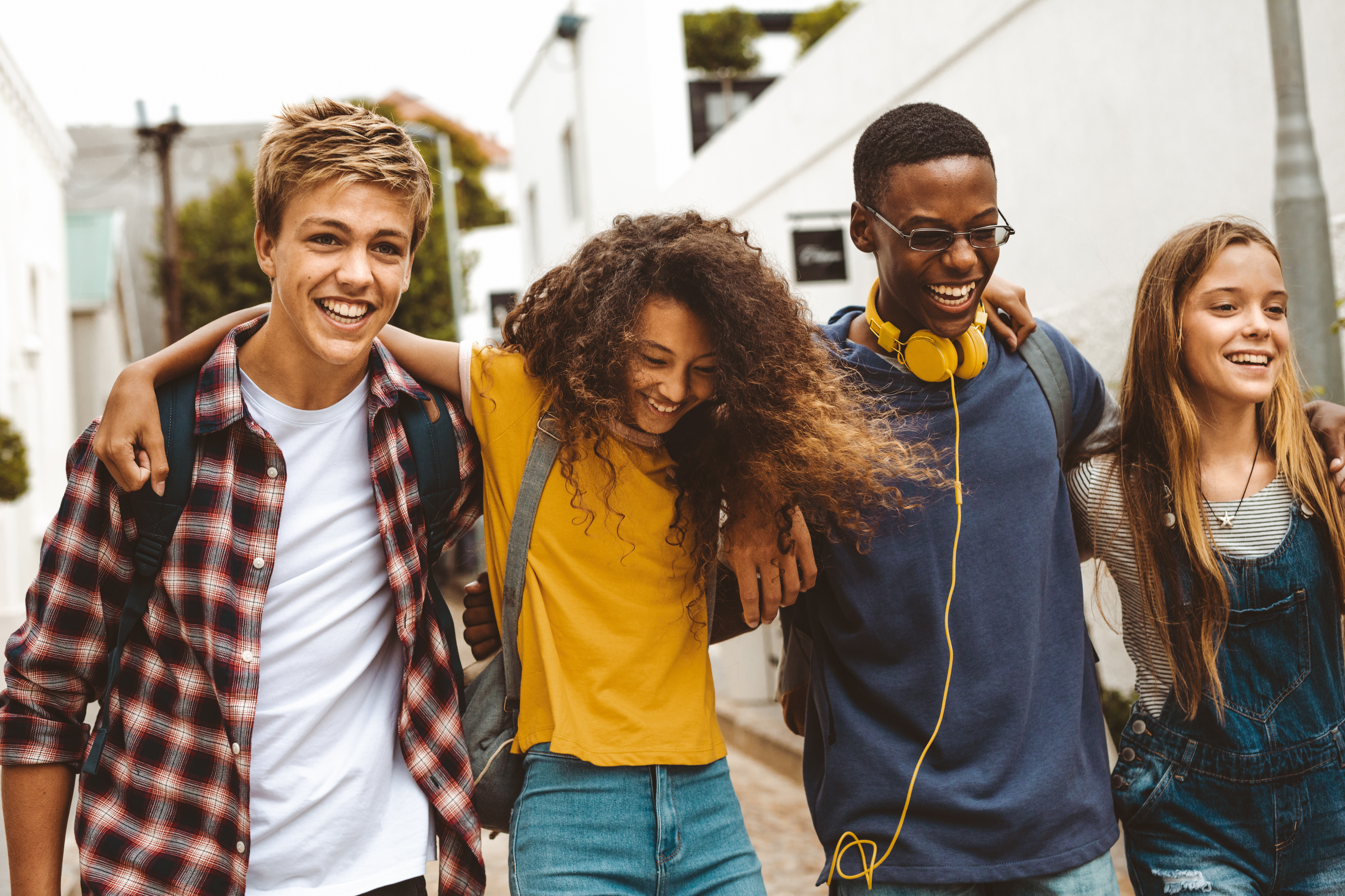 Cheerful teenage friends enjoying outdoors Cheerful teenage friends enjoying outdoors