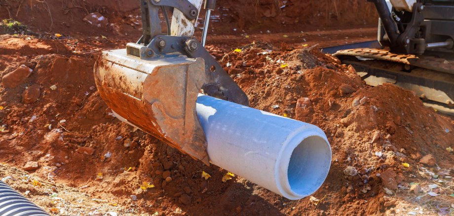 Installation of pipework at construction site to facilitate flow of rainwater into a water main collector