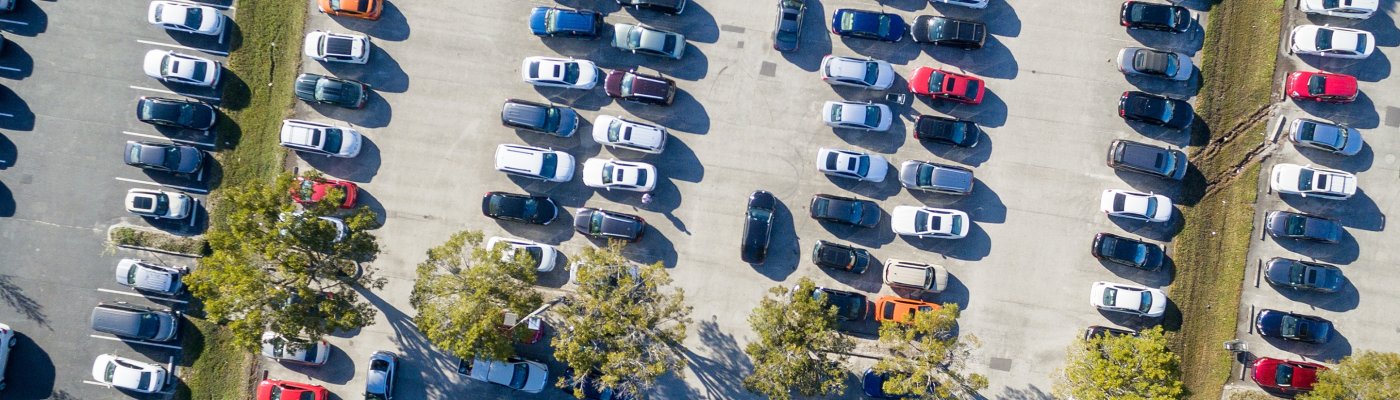 Overhead aerial view of crowded public parking. Business and shopping concept