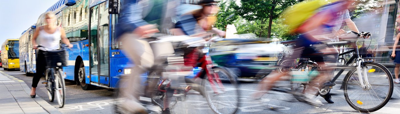 Motion blurred bicyclists in traffic