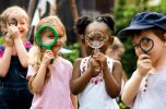 Group of kindergarten kids friends holding magnifying glass for Group of kindergarten kids friends holding magnifying glass for