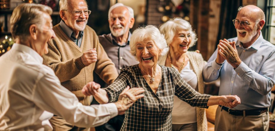 Smiley happy seniors dancing and having fun celebrating party in nursing home, elderly people enjoying a lively social activity gathering