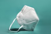 White FFP2, KN95 respirator. Dust protection respirator or medical respiratory mask against the virus. Surgical protective mask. prevention of the spread of coronavirus pandemic COVID-19 SARS-COV-2 White FFP2, KN95 respirator. Dust protection respirator or medical respiratory mask against the virus. Surgical protective mask. prevention of the spread of coronavirus pandemic COVID-19 SARS-COV-2