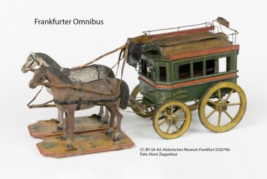 Pferdeomnibus: Zwei Pferde ziehen eine Kutsche